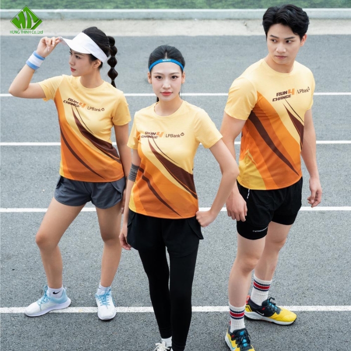 Ao thun dong phuc quang cao mau vang phoi cam (1)