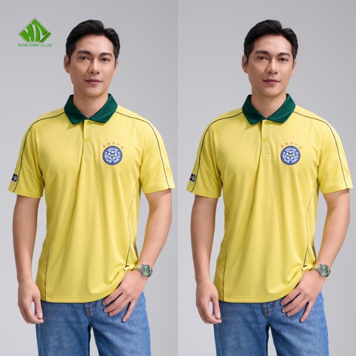 Ao thun dong phuc co tru mau vang chanh phoi xanh la dam